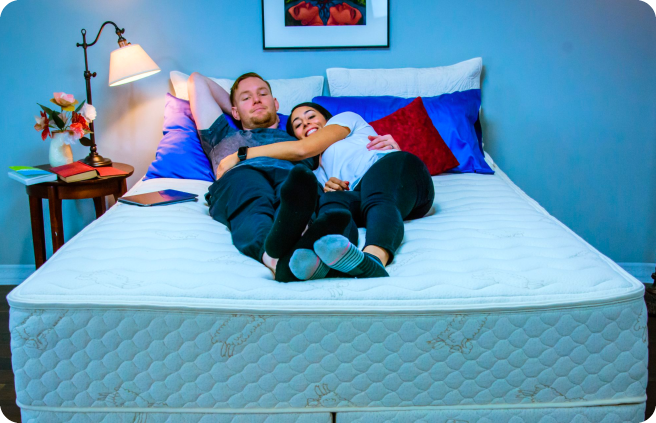 a couple relaxing on a talalay mattress